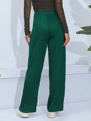 Dark green wide-leg trousers with button detail, shown from the back.
