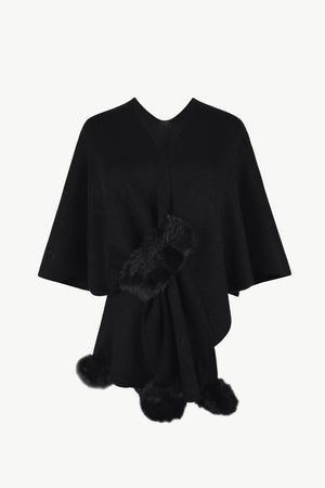 Black knit cape with fur trim detail at the front and hem.