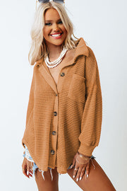 Caramel waffle knit button-down shirt jacket with a collar and chest pocket.