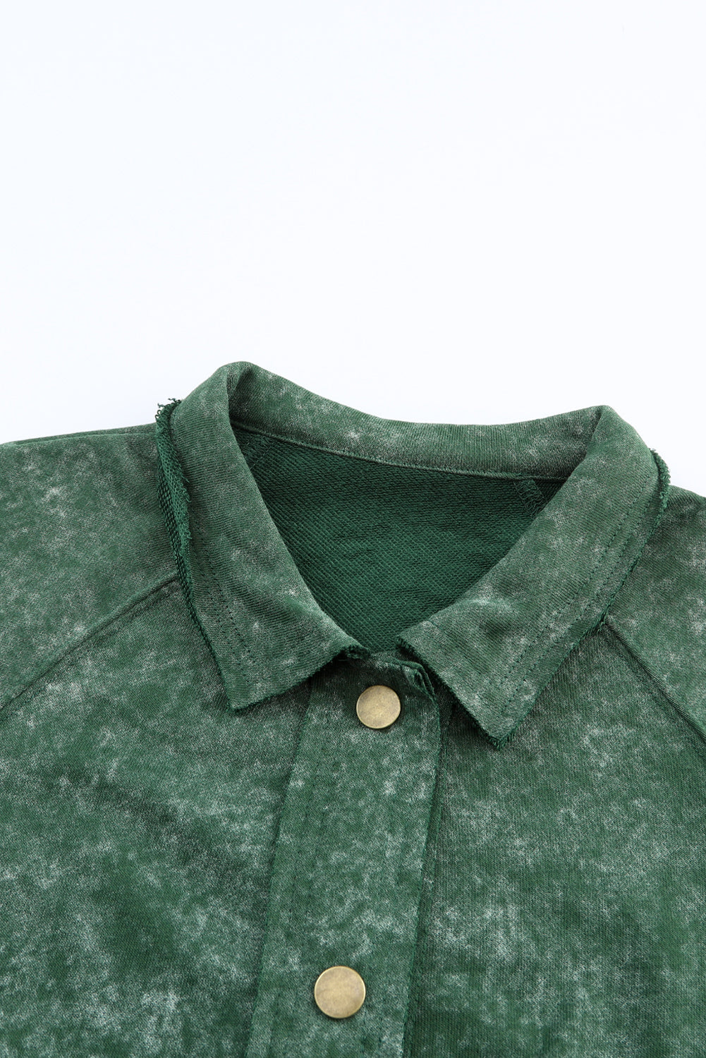 Green washed cotton utility jacket with distressed details and brass buttons.