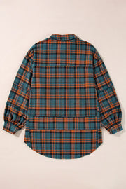 Oversized plaid overshirt in French blue with layered hem detail and cuffed sleeves.