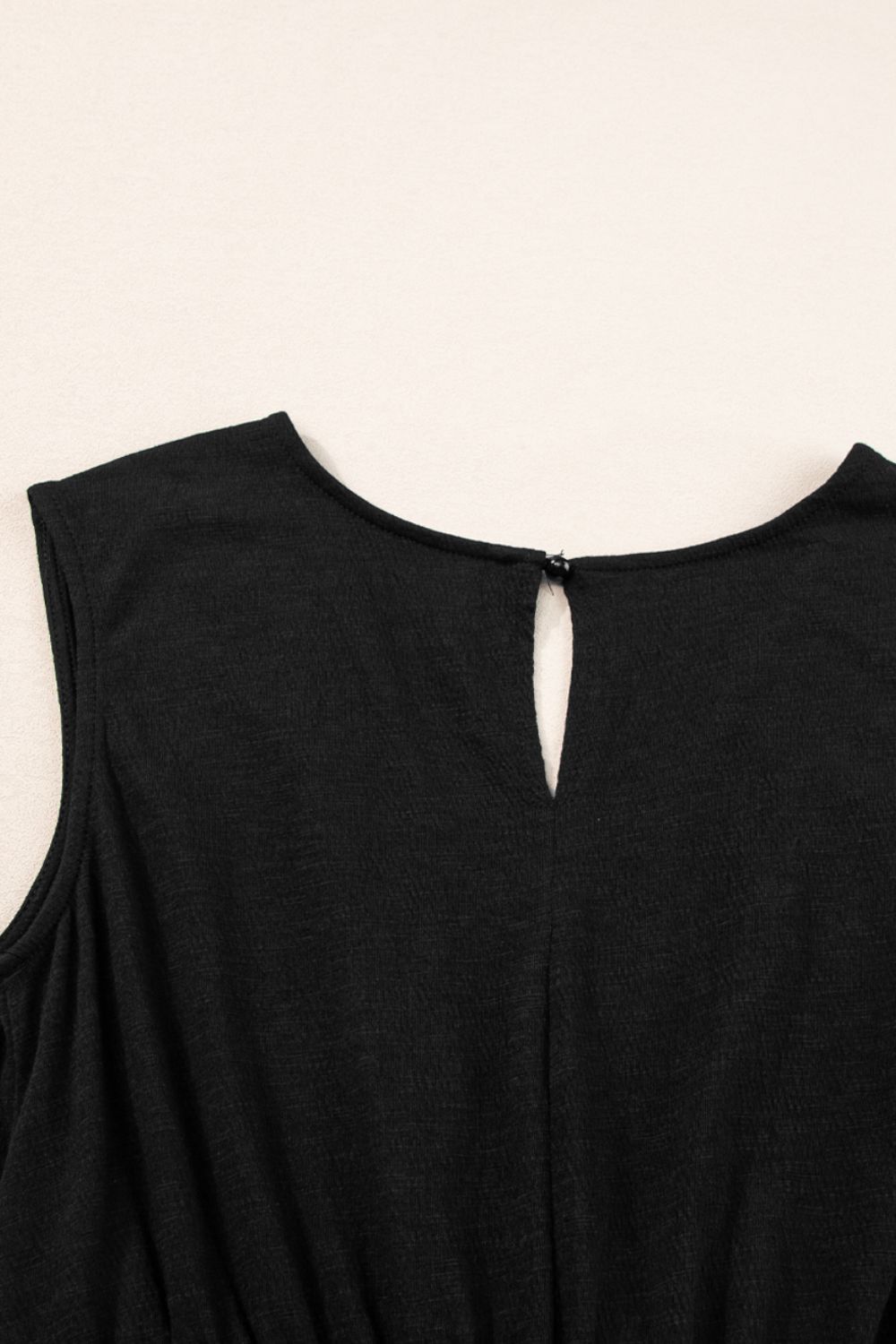 Black textured ribbed jumpsuit with keyhole neckline detail