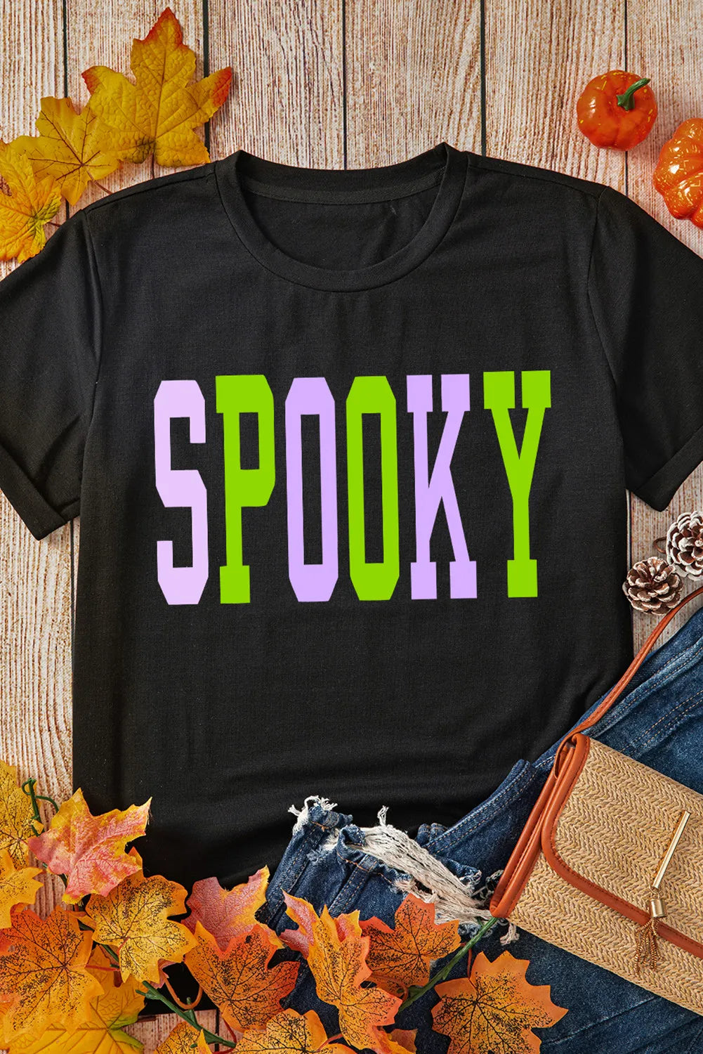 Black t-shirt with purple and green SPOOKY collegiate graphic
