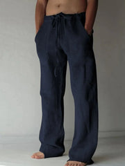 Navy linen blend wide-leg drawstring trousers with pockets.