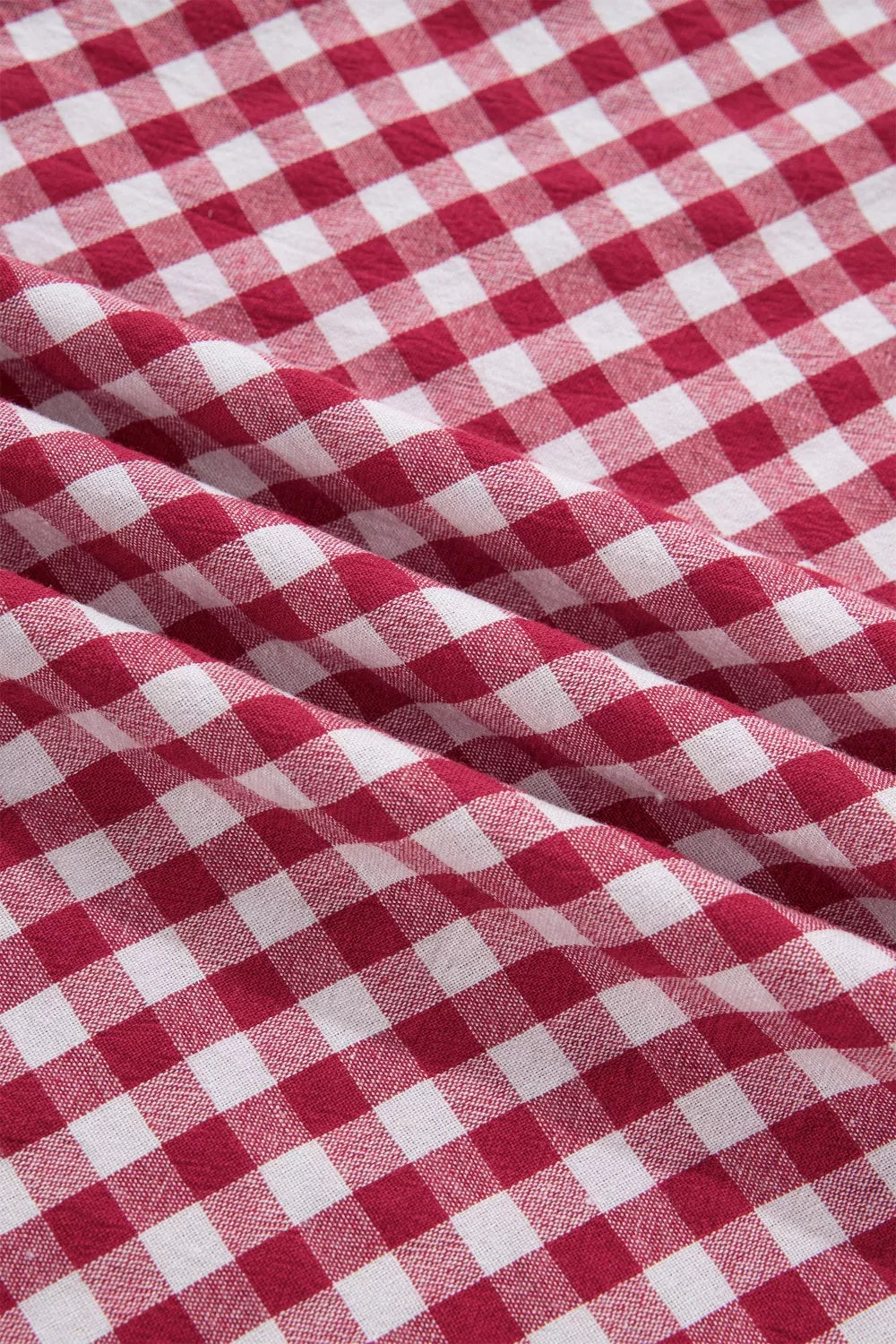 Vibrant red and white gingham cotton blend shirt with puff sleeves and a chic casual style.
