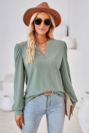 Sage green textured blouse with bishop sleeves and v-neck
