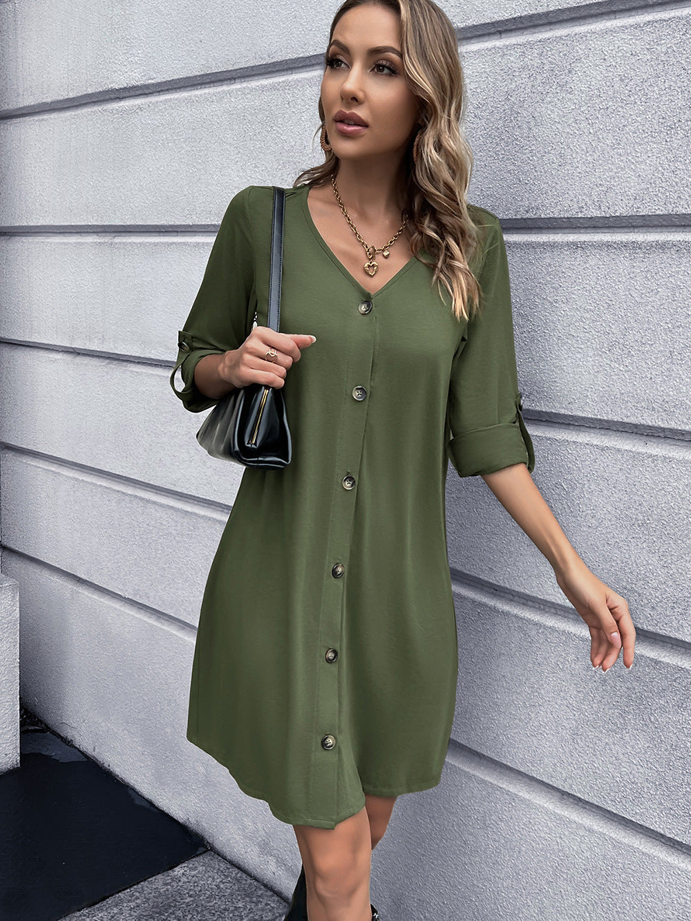 Olive green button-down mini dress with V-neck and roll-tab sleeves.