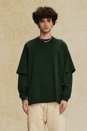 Layered sleeve oversized tee in dark green with crew neck and long sleeves.