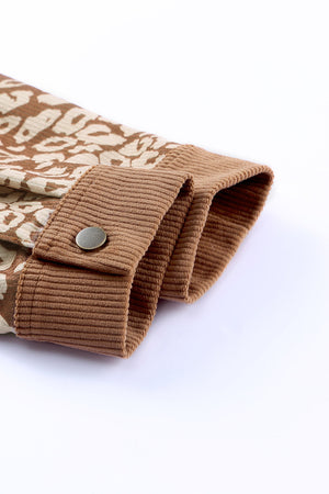 Camel corduroy jacket detail with leopard print panel and button closure.
