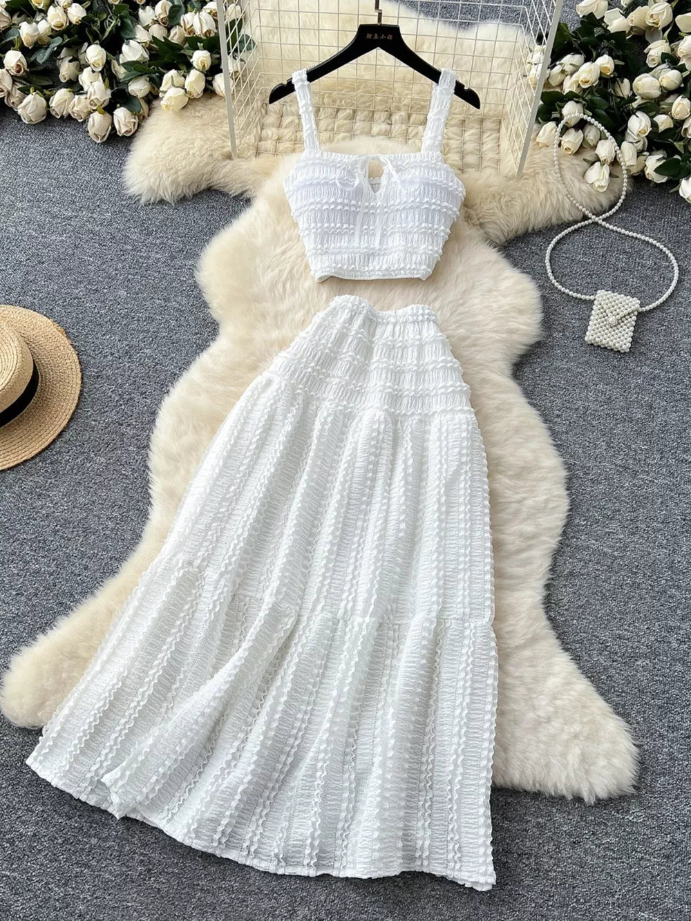 White ruched crop top and maxi skirt set with tie detail.