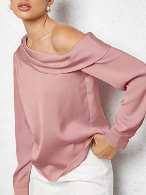 Elegant one-shoulder satin shirt in rose pink with draped neckline and button cuff.