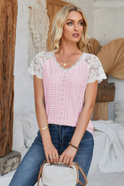 Pink eyelet raglan blouse with white lace short sleeves and V-neck.