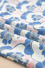 Blouse with blue, pink, and white floral print polyester fabric