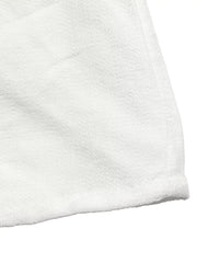 White terry cloth fabric detail with a hemmed edge