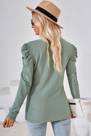 Light green textured puff-sleeve crew neck top with diamond pattern