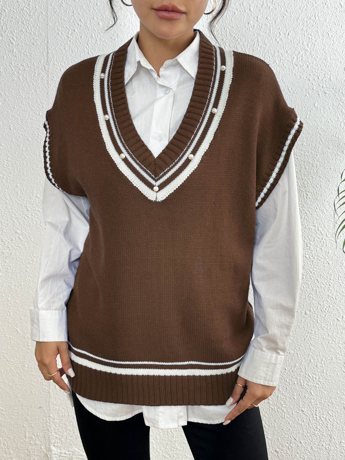 Brown knit vest with varsity stripes and pearl trim, v-neck, acrylic.