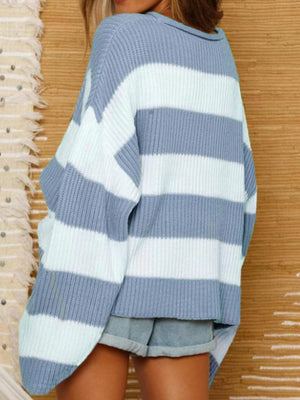 Striped oversized knit sweater in blue and white with a relaxed fit and crew neck.
