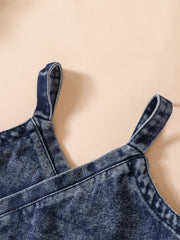 Acid-wash denim cami with adjustable straps.