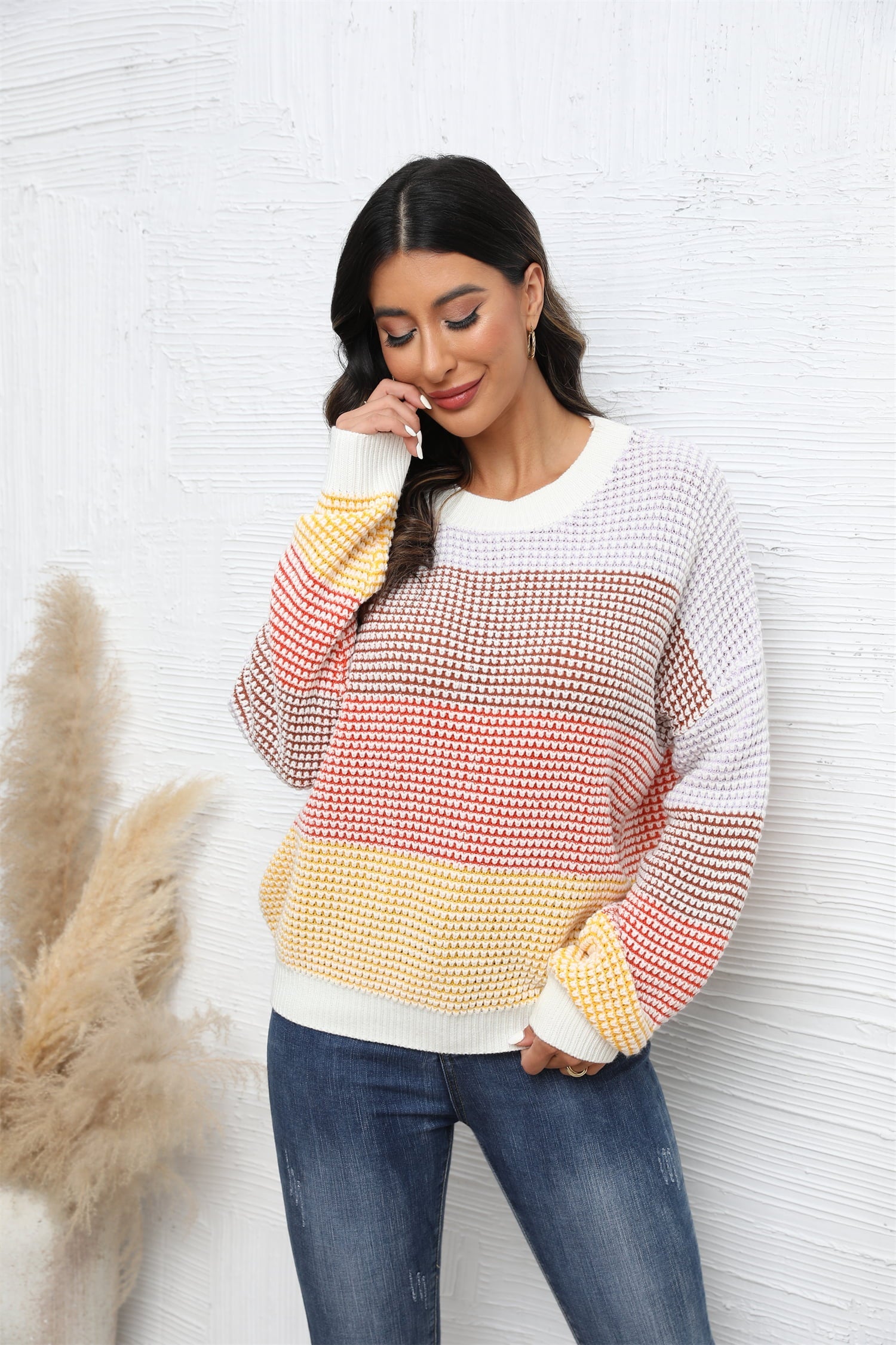 Horizontal stripe waffle knit pullover sweater in apricot and white with crew neck and long sleeves.