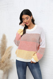 Horizontal stripe waffle knit pullover sweater in apricot and white with crew neck and long sleeves.