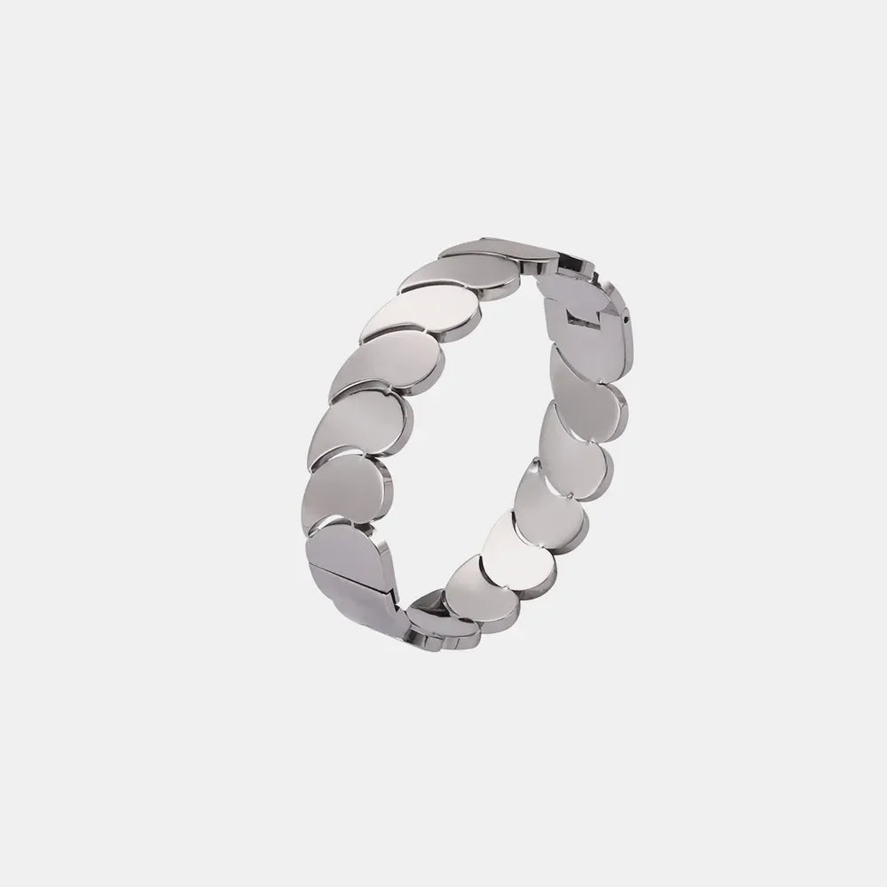 Sculpted gold leaf bracelet in silver tone with overlapping petal links