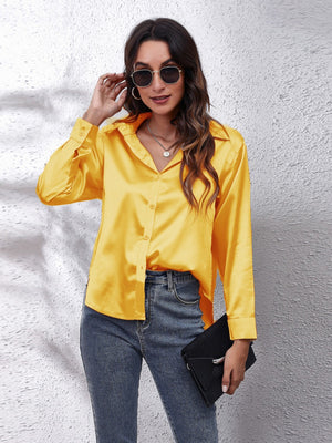 Yellow satin finish button-up shirt with effortless drape, collared neckline and button cuffs.