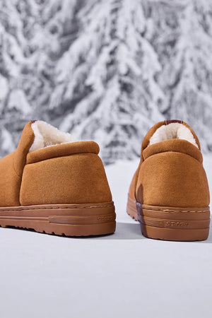 Caramel suede shearling-lined house booties with rubber soles.