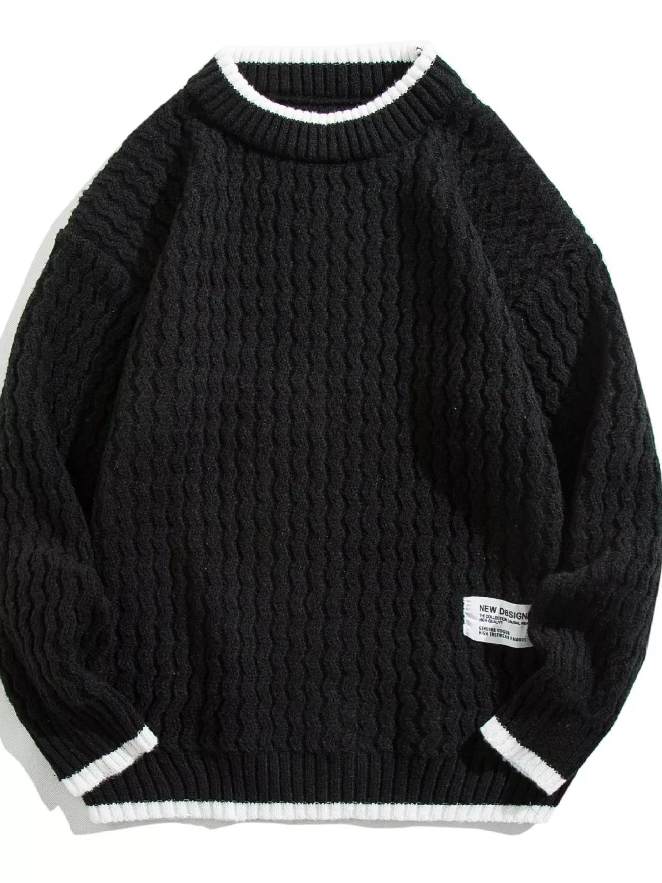 Black textured knit sweater with white trim on collar and cuffs.