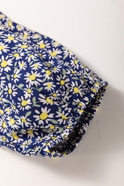 Daisy print smocked peplum blouse in dusty blue 100% viscose with elasticated cuffs.