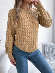 Camel textured cable knit sweater with asymmetric hem and crew neck.