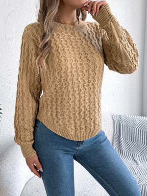 Camel textured cable knit sweater with asymmetric hem and crew neck.