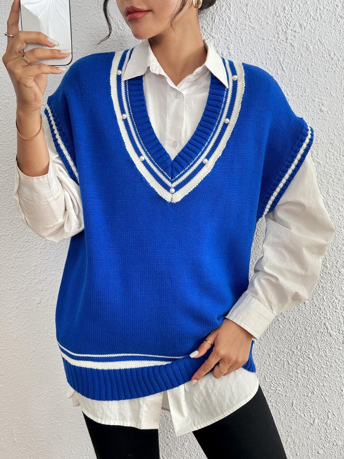 Blue acrylic knit vest with varsity stripes and pearl trim neckline and hem