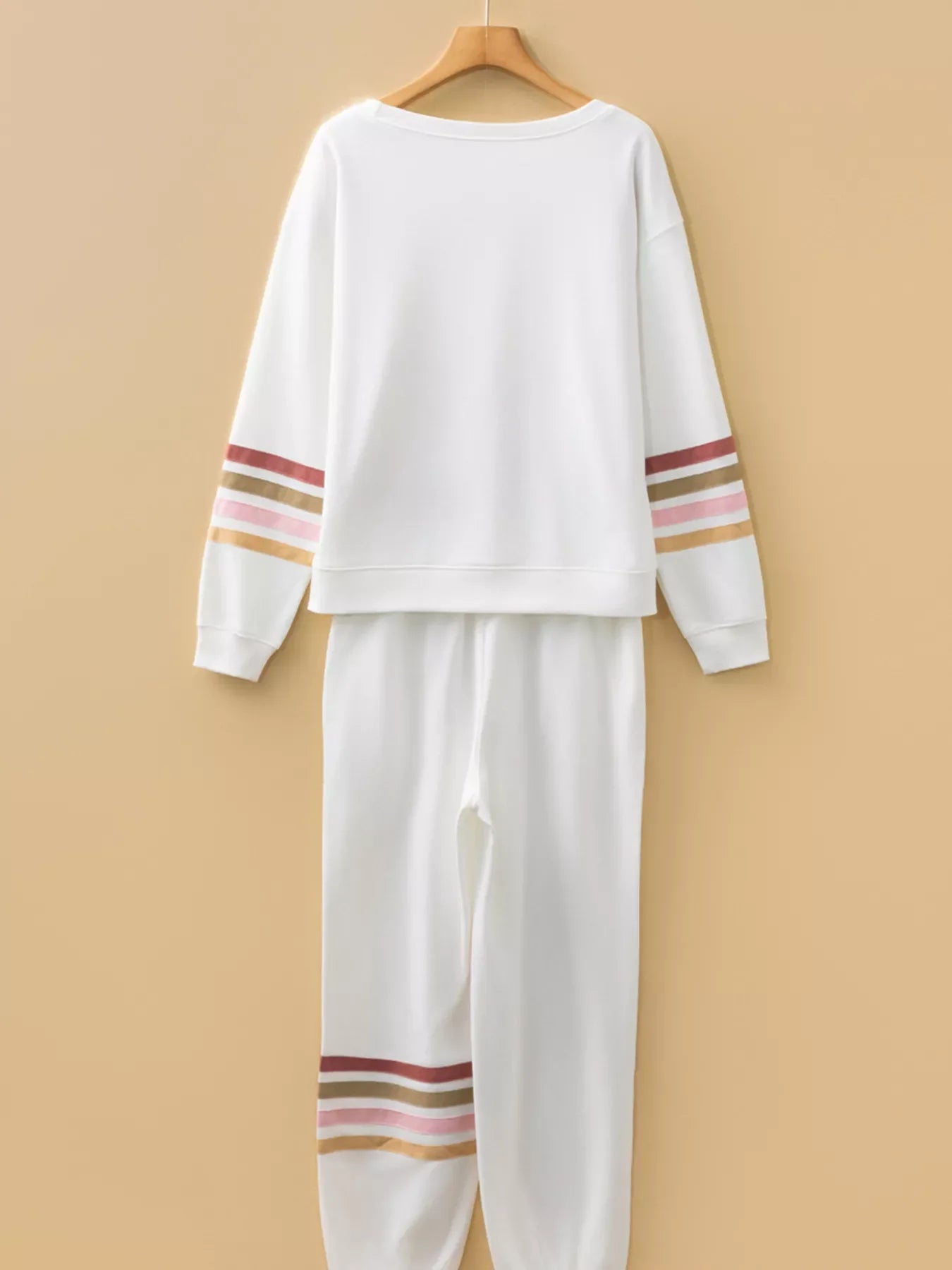 White loungewear set with striped sleeve and pant details