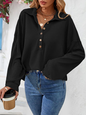 Black waffle knit henley blouse with button detail and collar