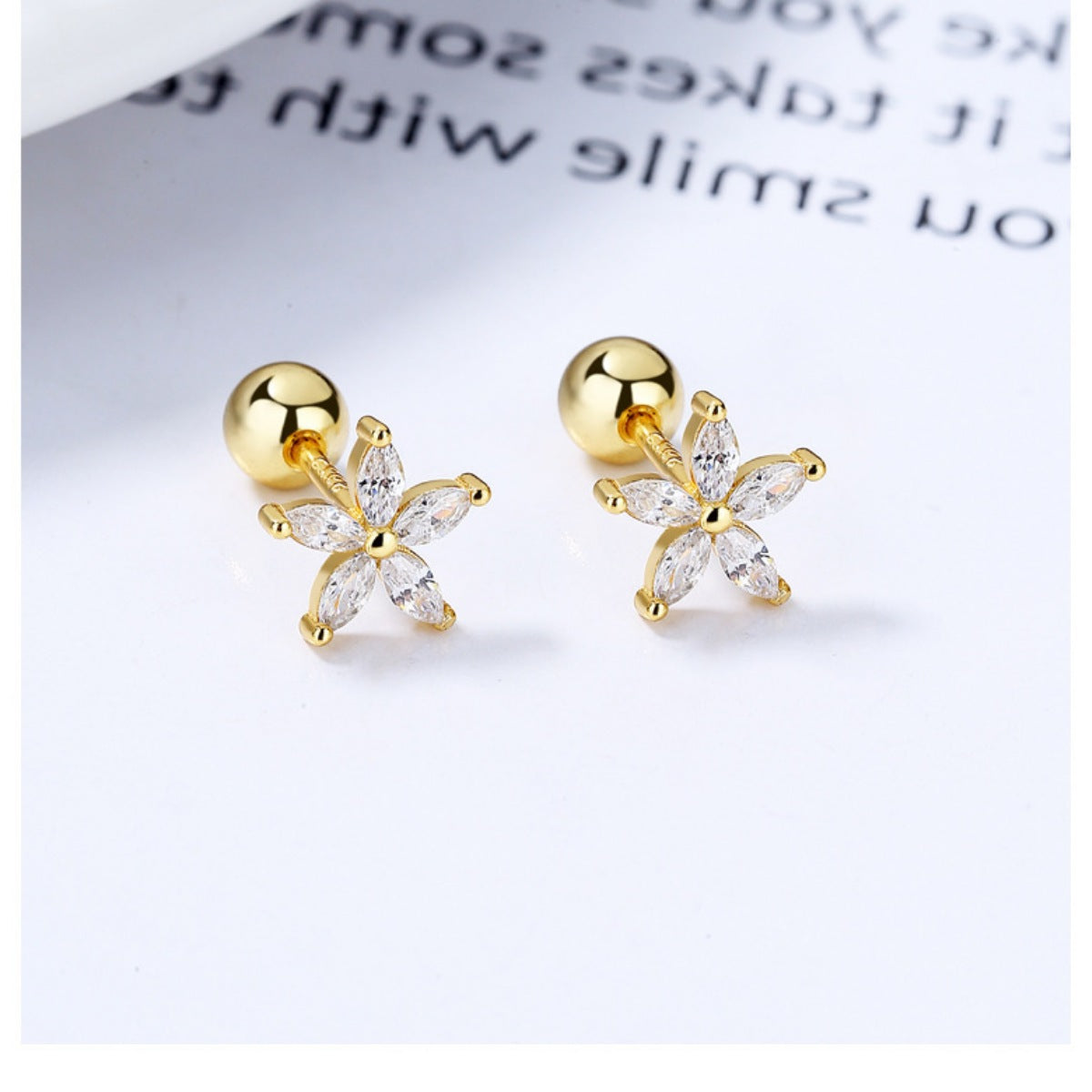 Gold flower stud earrings with clear marquise-cut stones, 925 sterling silver.