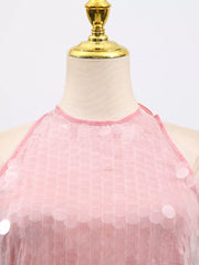 Pink halter mini dress with iridescent sequins and a mesh overlay.