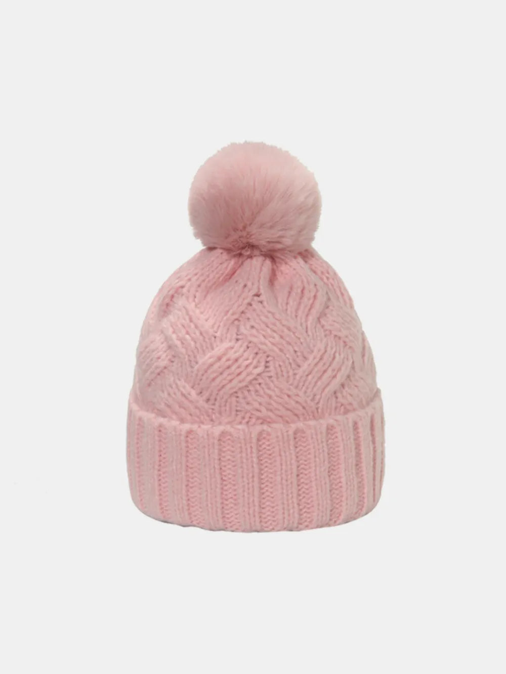Blush pink cable knit acrylic beanie with a fuzzy pom pom.