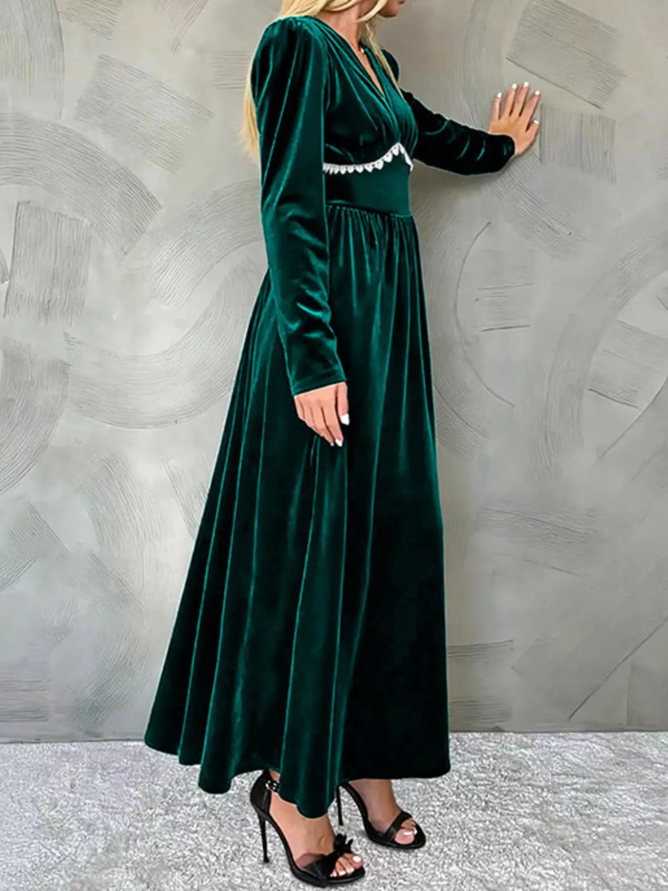 Green velvet maxi dress with V-neck, long sleeves, and ruched detail.