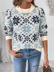 Snowflake Fair Isle crewneck sweater in light blue acrylic with a cream neckline and cuffs.