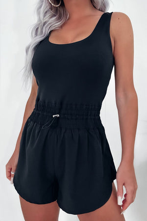 Black tank romper with gathered drawstring waist and short shorts