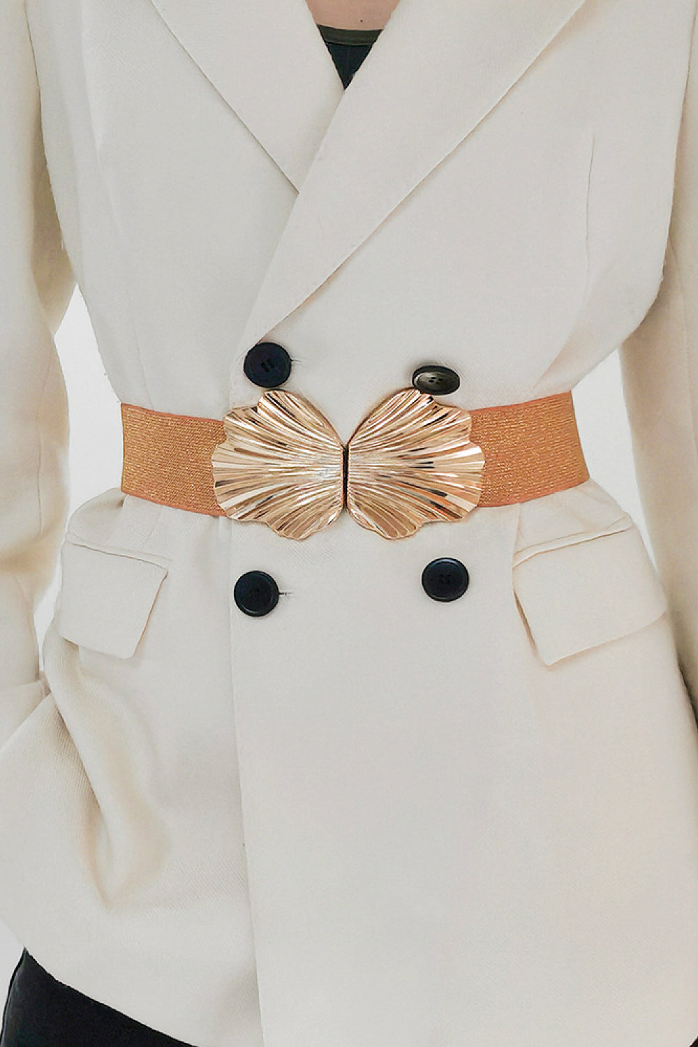 Caramel elastic belt with sculpted gold butterfly buckle detail