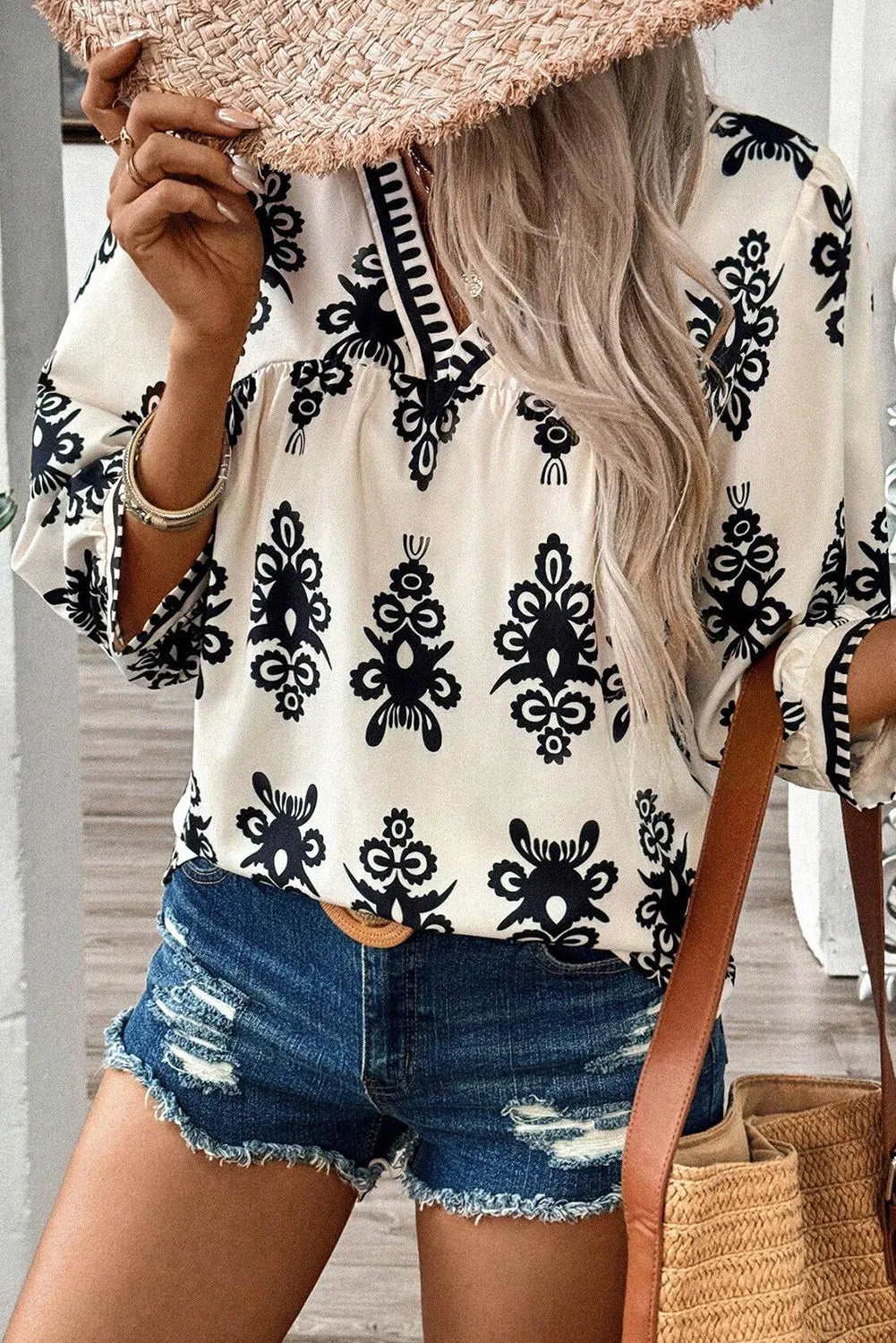 Ivory V-neck blouse with black embroidery and contrast trim, 3/4 sleeves
