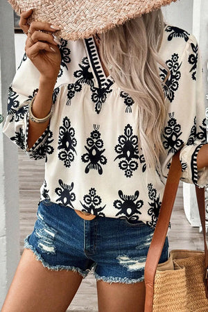 Ivory V-neck blouse with black embroidery and contrast trim, 3/4 sleeves