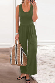Moss green gathered waist wide leg jumpsuit with scoop neck and sleeveless design.