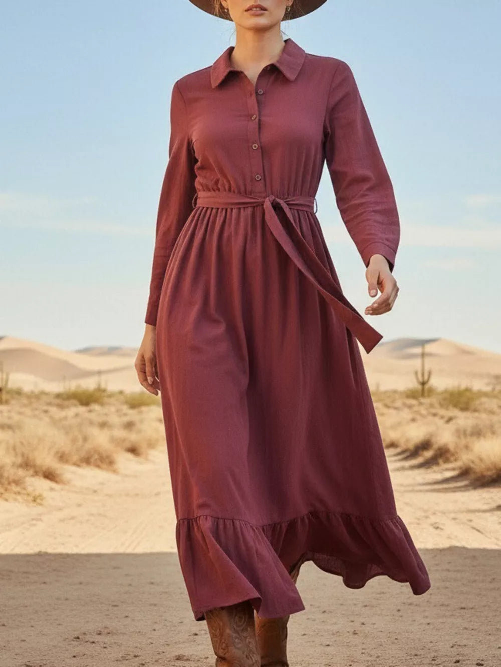 Red belted maxi dress with button front, long sleeves, and ruffled hem.