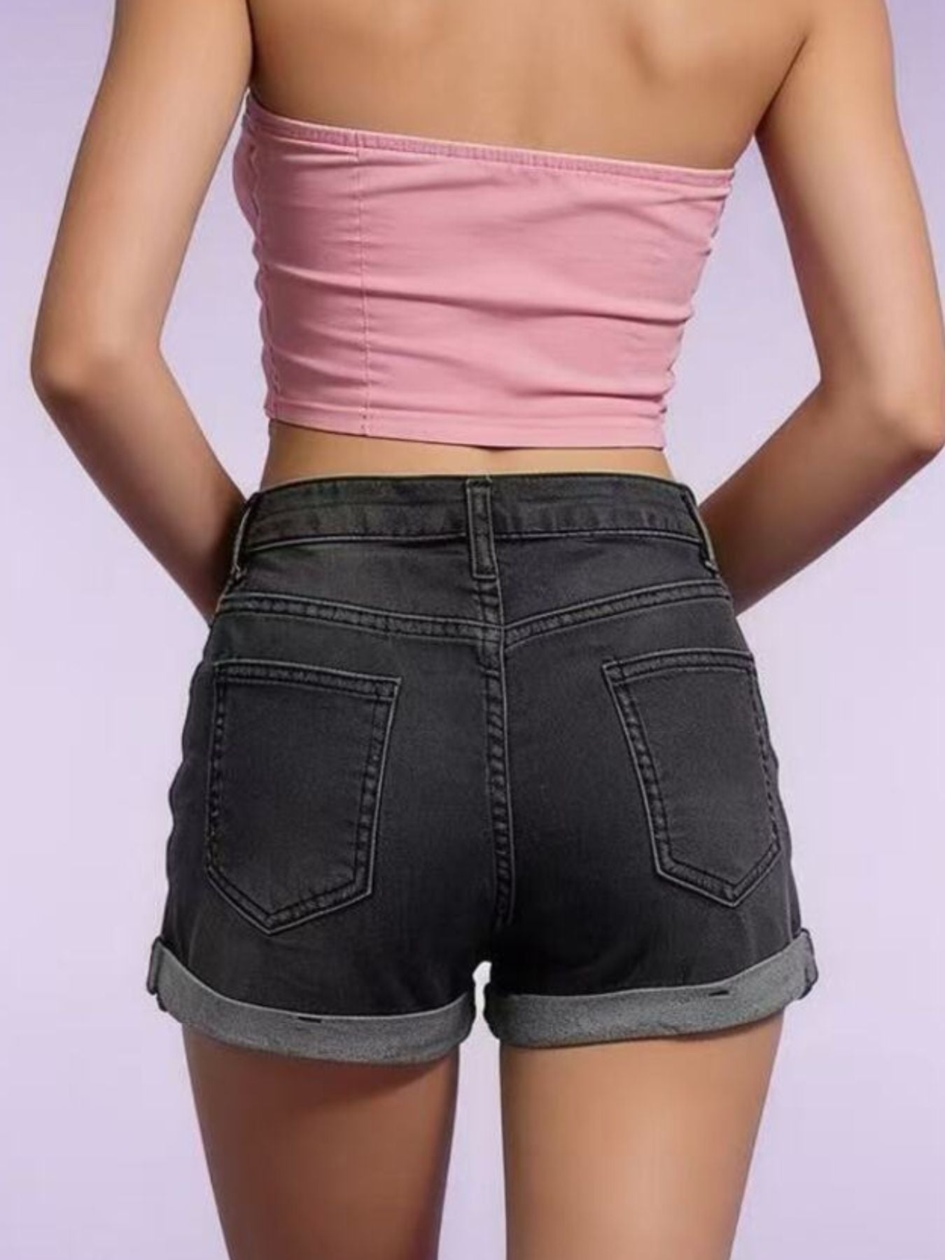 Black denim shorts with cuffed hem and button fly, showing back pockets.