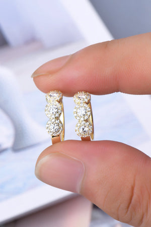 Gold triple cluster diamond huggie hoop earrings with pave diamond detail.