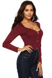 Ribbed button-down bodysuit in Brick Red with a square neckline and long sleeves.