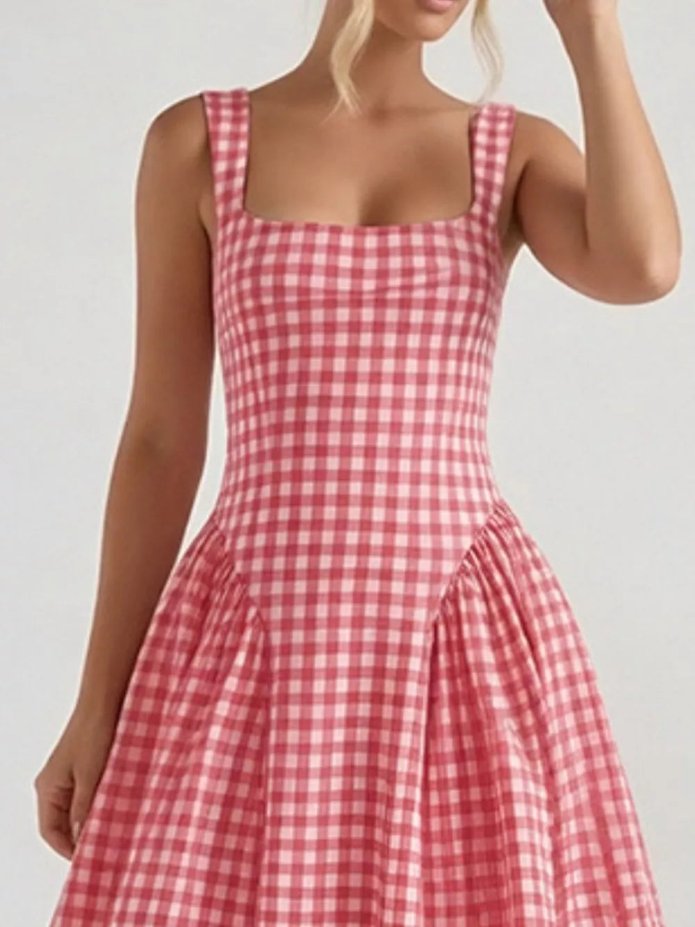 Plaid square neck midi dress in blush pink with a-line skirt and wide straps.