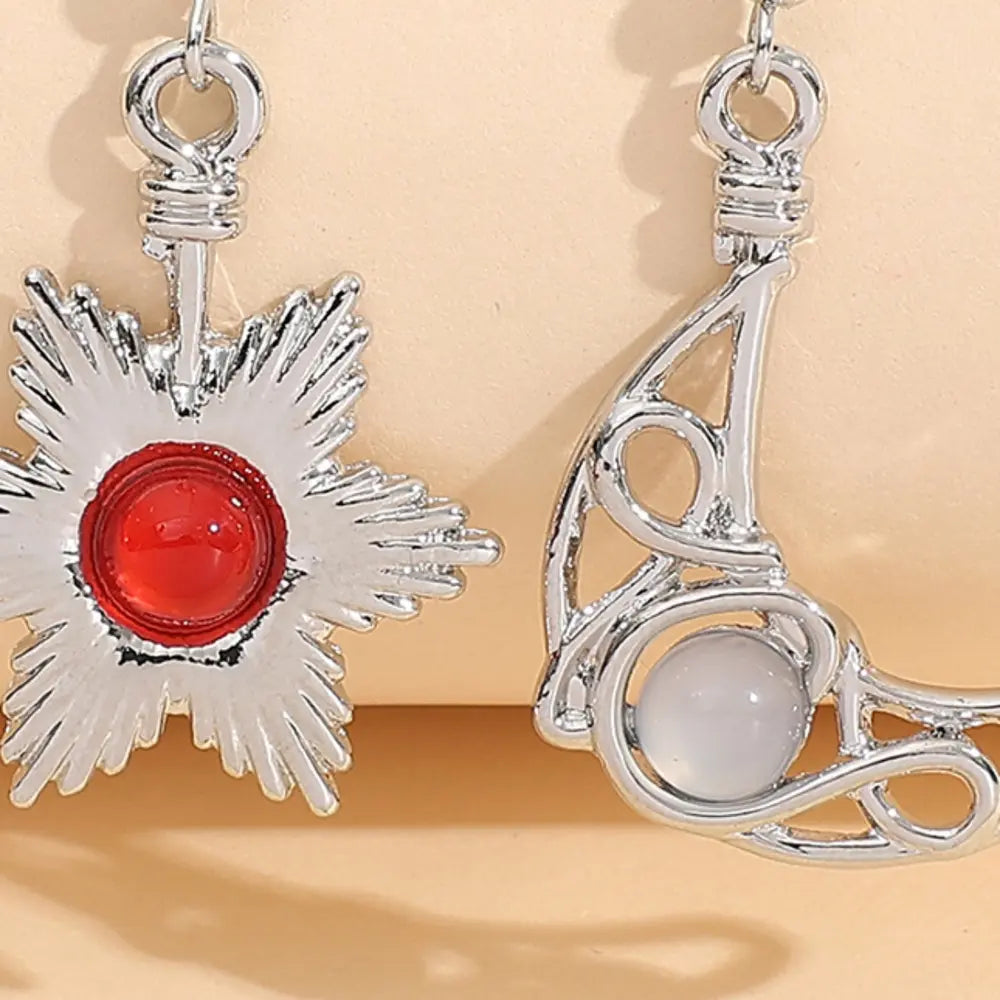 Celestial asymmetrical drop earrings in silver with red and white stones